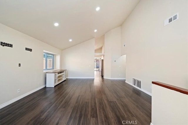 unfurnished living room featuring dark wood-style floors, baseboards, visible vents, and recessed lighting