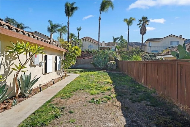 view of yard with a fenced backyard