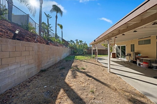 view of yard featuring a patio and a fenced backyard