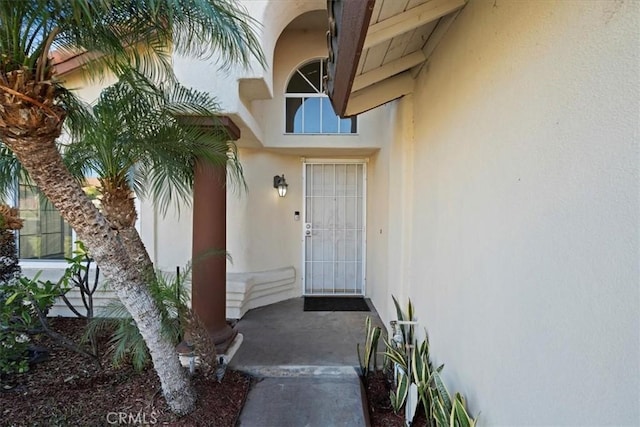 doorway to property with stucco siding