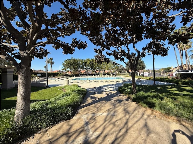 view of property's community with a yard