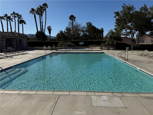 community pool with a patio