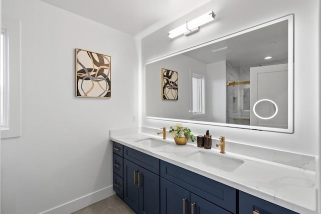 bathroom with vanity, tile patterned flooring, and a shower with shower door