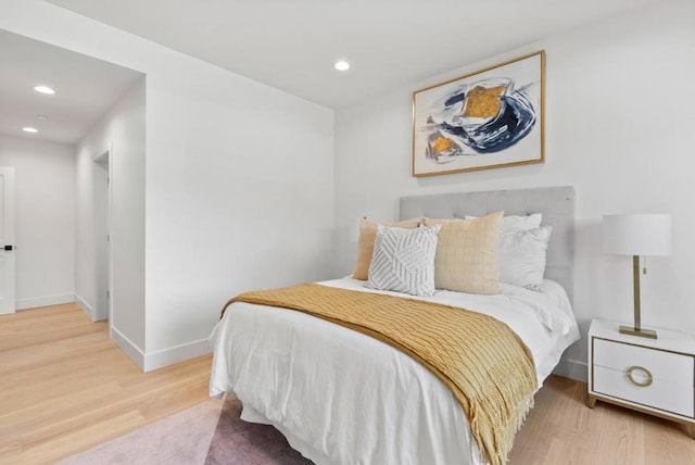 bedroom with hardwood / wood-style floors