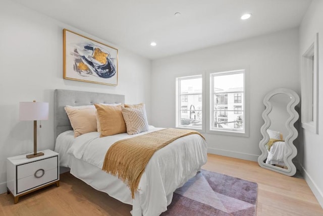 bedroom with light wood-type flooring