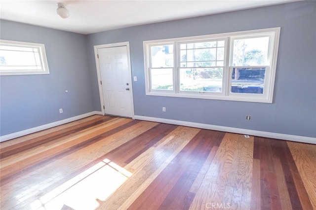 spare room with hardwood / wood-style flooring