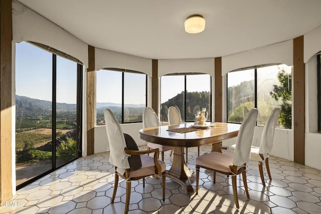 sunroom featuring a mountain view