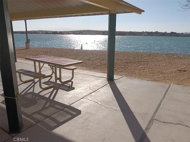 view of patio featuring a water view