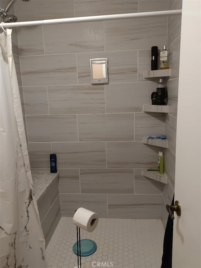 bathroom featuring curtained shower