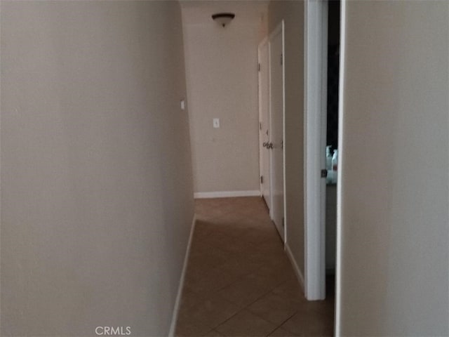 hall with tile patterned flooring