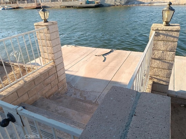 dock area featuring a water view