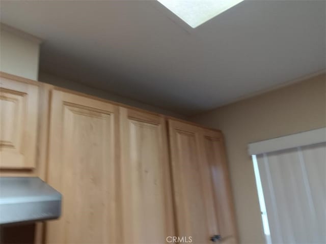 interior details featuring light brown cabinetry