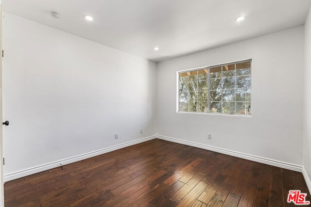 empty room featuring hardwood / wood-style flooring