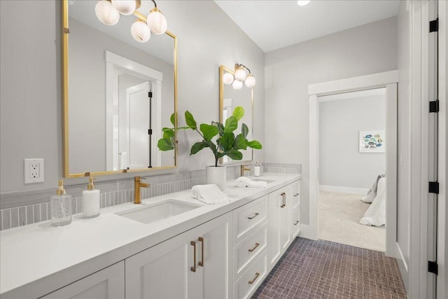 bathroom with tile patterned floors and vanity