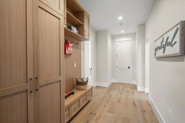 mudroom with light wood-type flooring