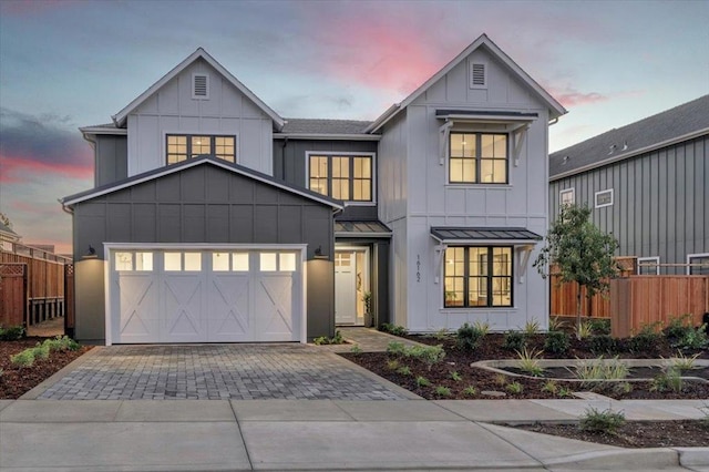 modern farmhouse style home with a garage