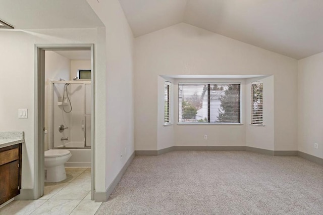 full bathroom with toilet, vaulted ceiling, vanity, and shower / bath combination with glass door