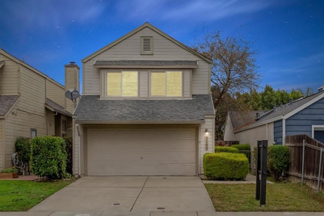 view of front of property featuring a garage