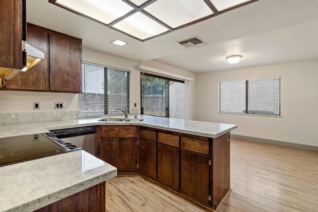 kitchen with sink, dishwasher, light hardwood / wood-style floors, kitchen peninsula, and dark brown cabinets