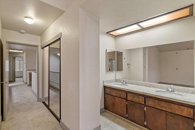 bathroom with vanity and tile patterned floors