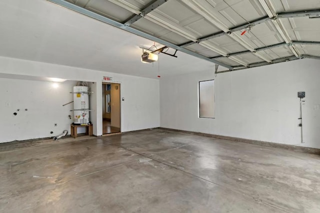 garage with a garage door opener and secured water heater