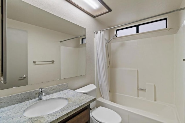 full bathroom with toilet, shower / tub combo with curtain, and vanity