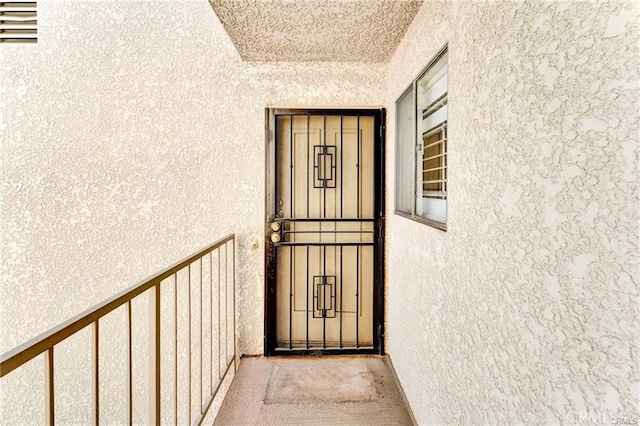 entrance to property featuring a balcony