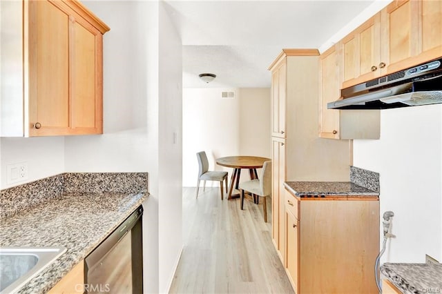 kitchen with light brown cabinetry, stainless steel dishwasher, and light hardwood / wood-style flooring