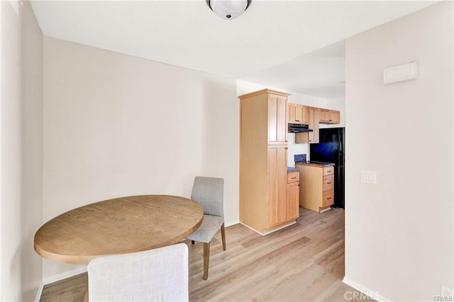 dining space with light hardwood / wood-style flooring