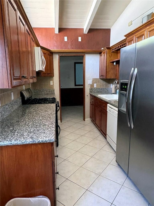 kitchen with sink, wooden ceiling, white appliances, tasteful backsplash, and dark stone counters