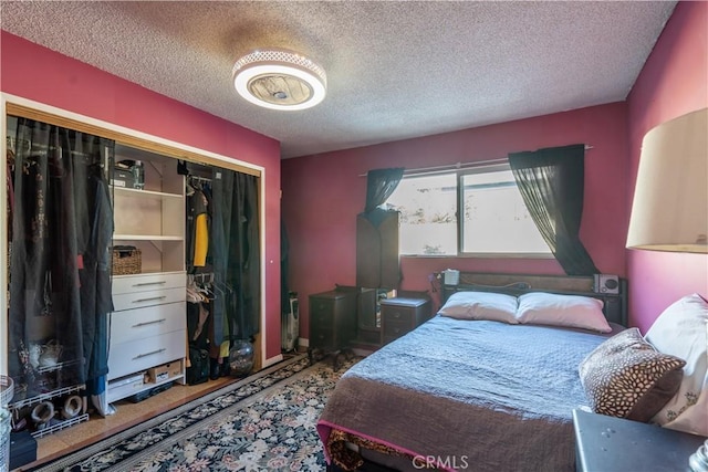 bedroom featuring a closet and a textured ceiling