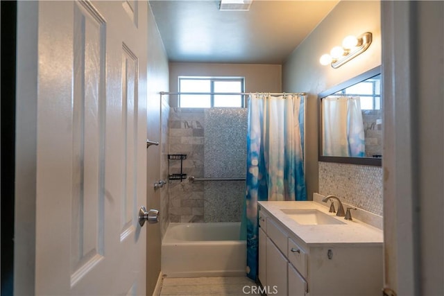 bathroom with vanity and shower / bath combo with shower curtain