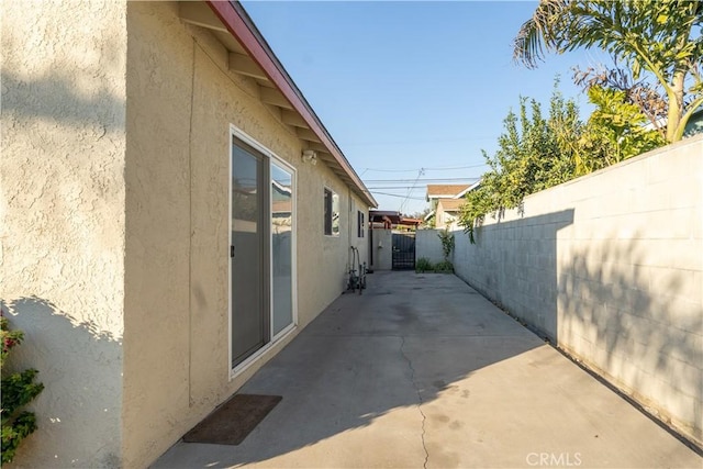 view of property exterior with a patio