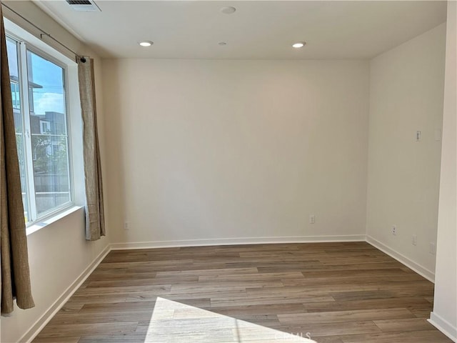 spare room featuring light hardwood / wood-style flooring