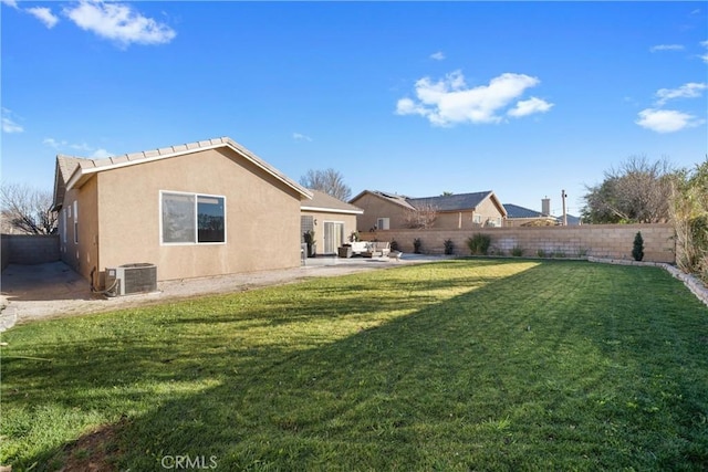 view of yard featuring a patio area and central AC unit