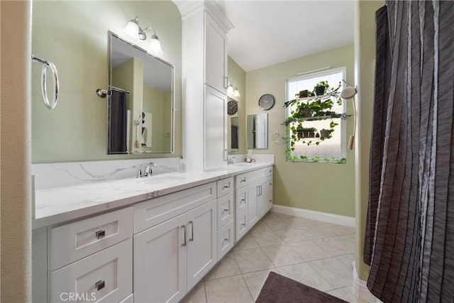 bathroom featuring tile patterned flooring and vanity