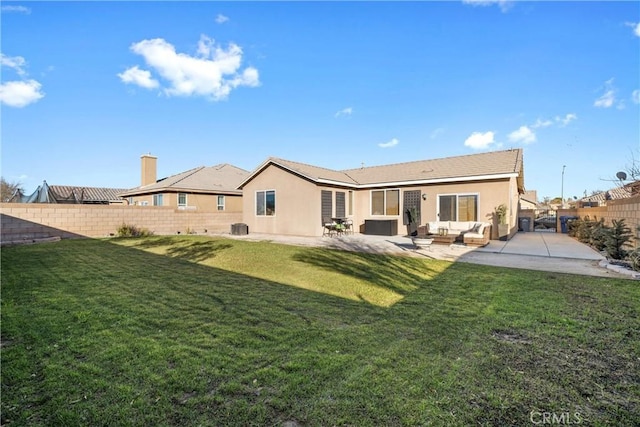 rear view of property with a lawn, central AC, an outdoor living space, and a patio