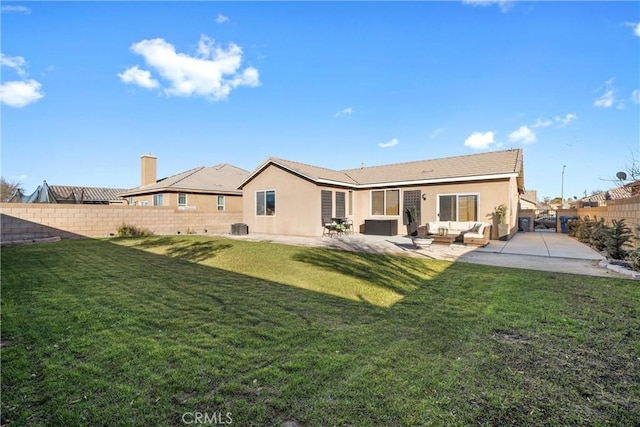 back of house featuring an outdoor hangout area, a patio, a lawn, and central AC