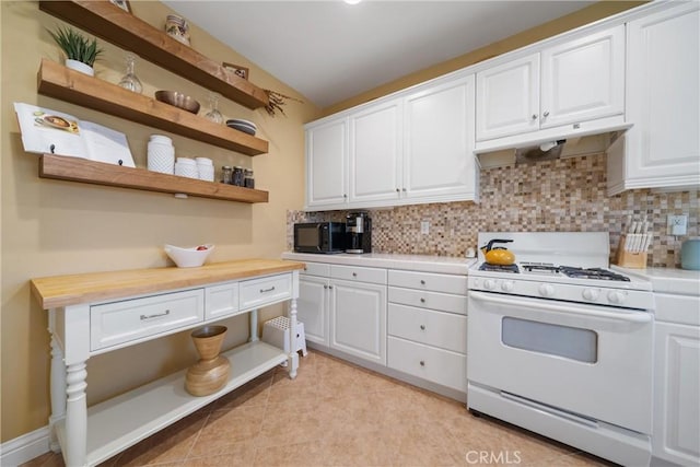 kitchen with white cabinets, backsplash, and white gas range oven