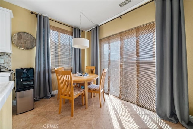 dining area with light tile patterned floors