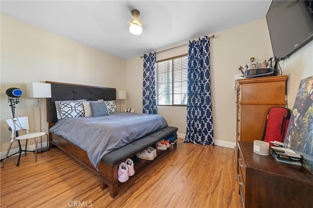 bedroom featuring ceiling fan and light wood-type flooring