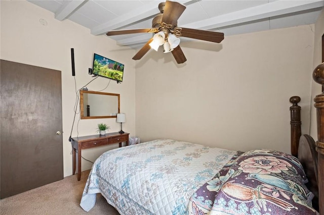 bedroom featuring ceiling fan, beamed ceiling, and carpet flooring