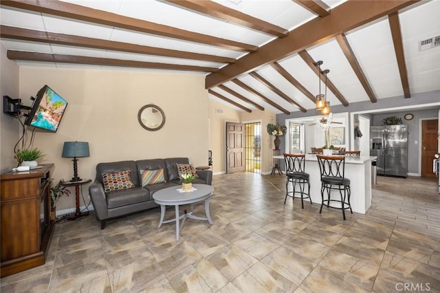 living room with ceiling fan and vaulted ceiling with beams