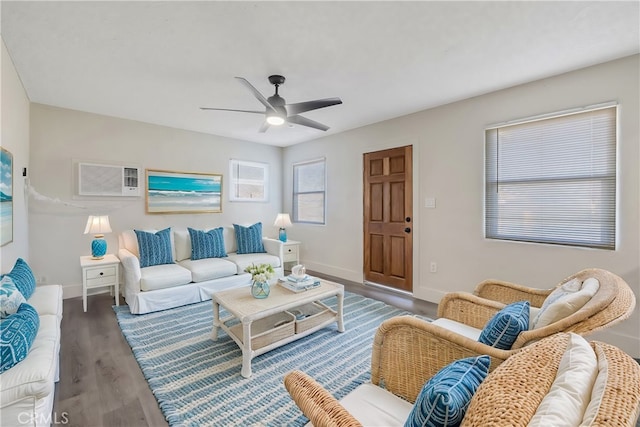 living room featuring an AC wall unit, ceiling fan, and dark hardwood / wood-style flooring