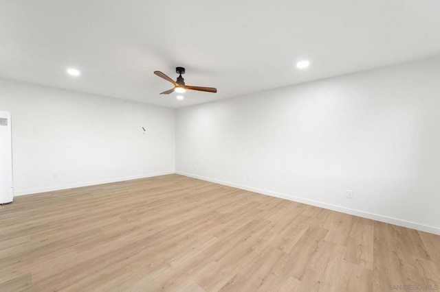 unfurnished room with light hardwood / wood-style floors and ceiling fan