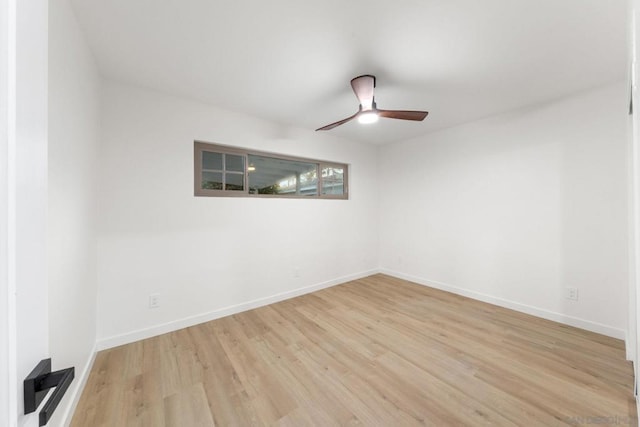 empty room featuring ceiling fan and light wood-type flooring