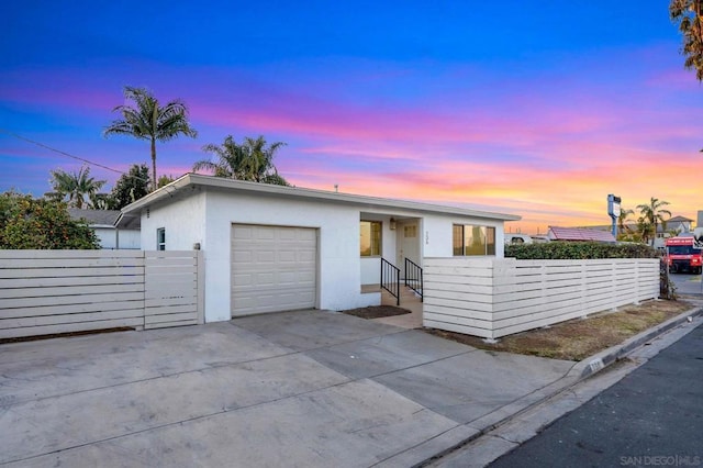 single story home with a garage