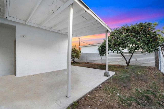 view of patio terrace at dusk