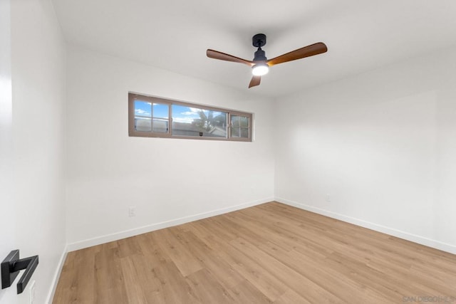 spare room featuring ceiling fan and light wood-type flooring