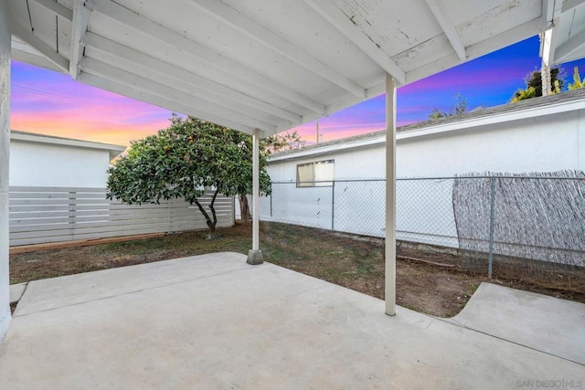 view of patio terrace at dusk